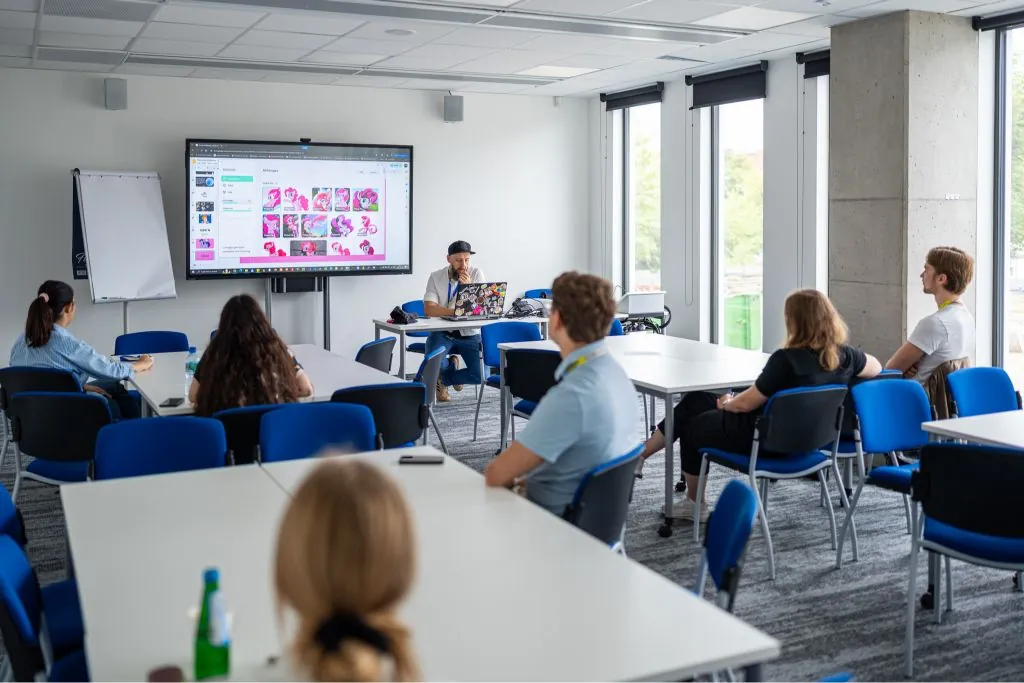 Marek Malinowski facilitating the My Little Pony machine learning workshop with the live classification dataset on screen