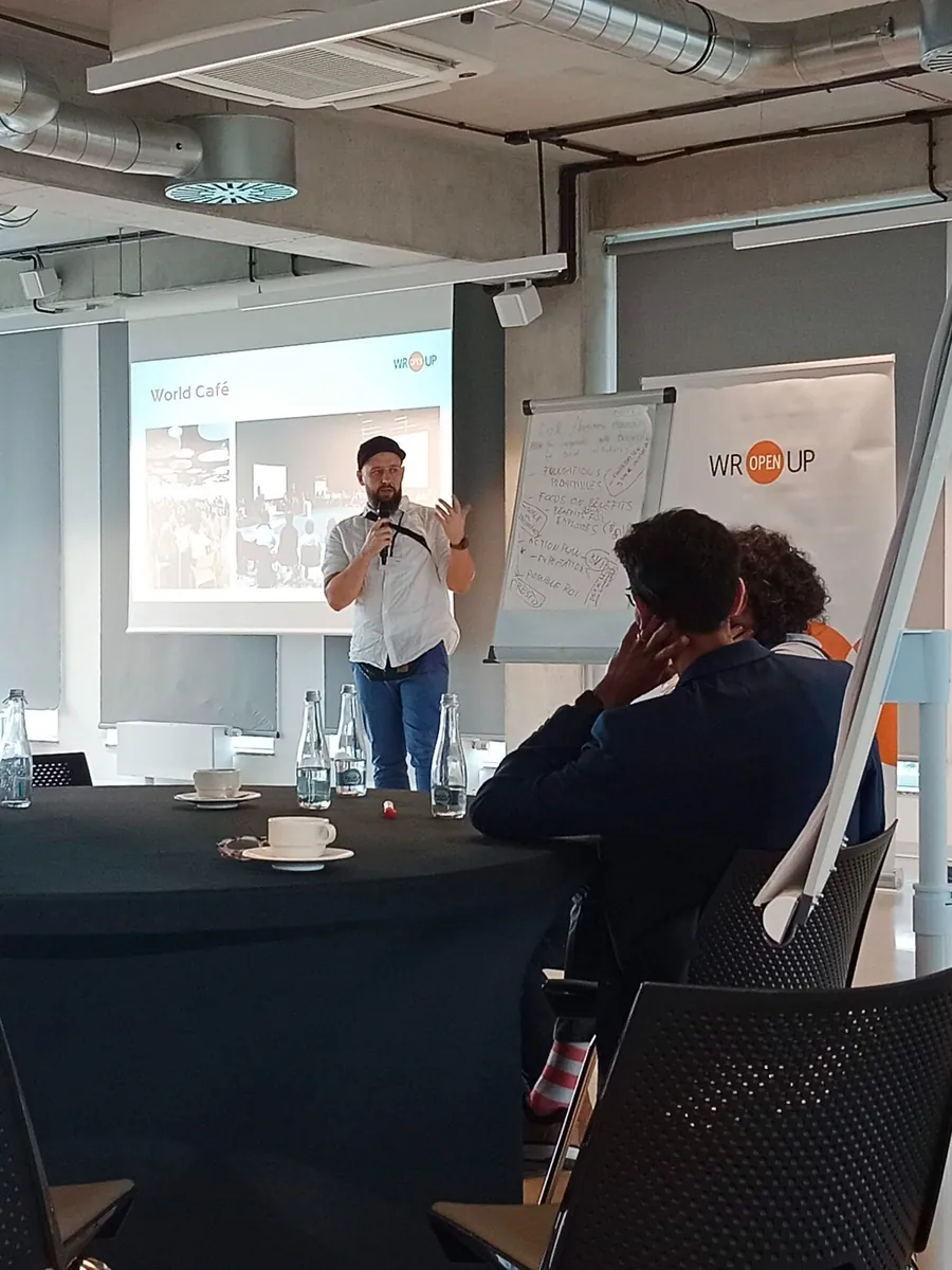 Marek Malinowski facilitating a World Cafe Design Thinking workshop for the WrOpenUp Foundation